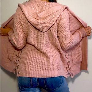 Woman’s pink cardigan